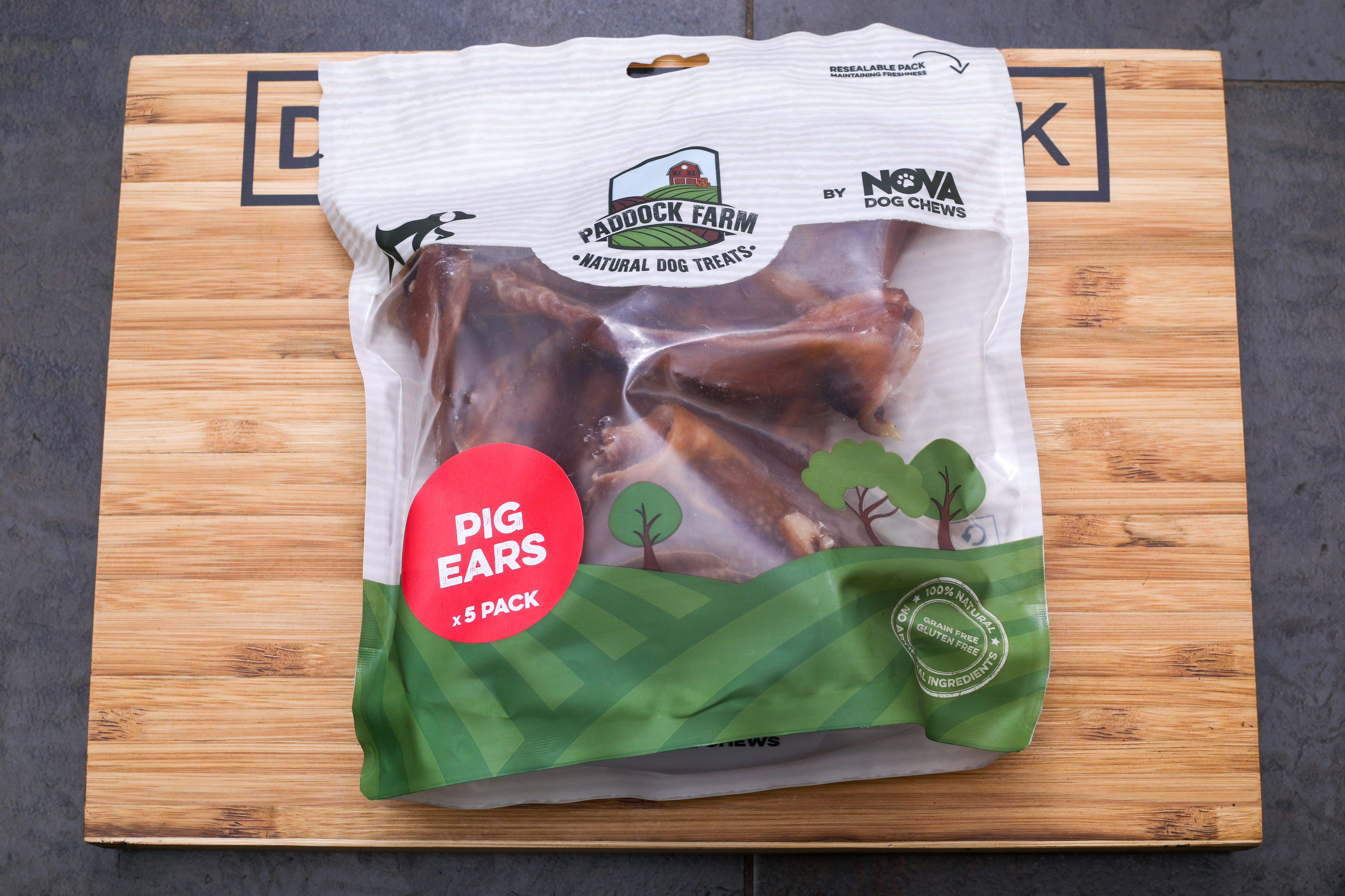 pig ears 5 pack nova dog chews on dog centre mk branded wooden board