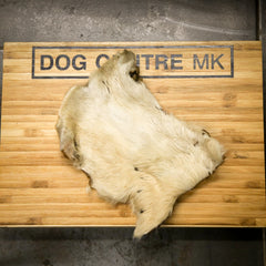 Hairy Beef skin on a wooden board with 'DOG CUTRE MK' branding.