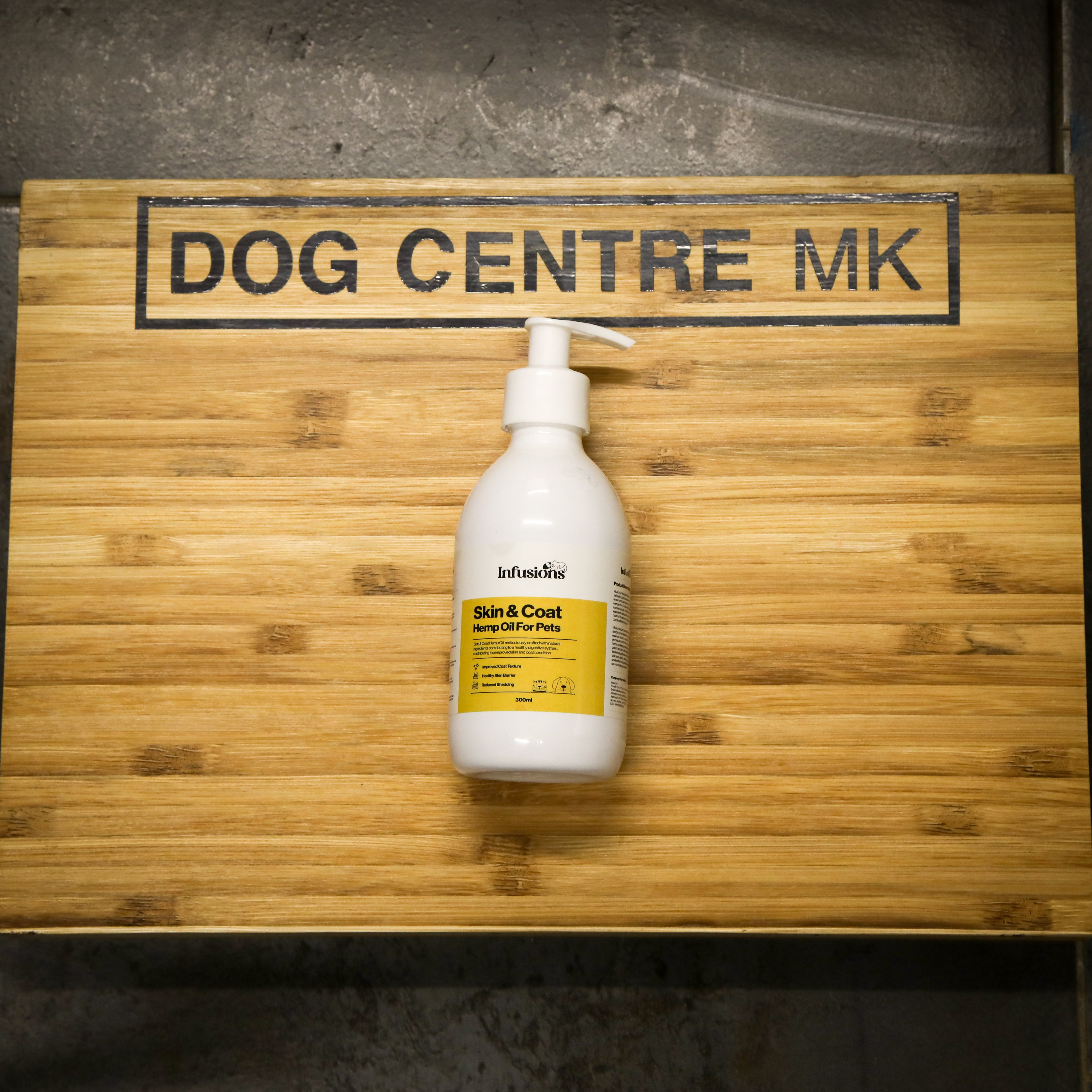 white ump bottle from infusions skin and coat hemp oil 300ml