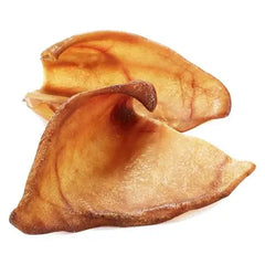 Dried pig ear dog treat on white background