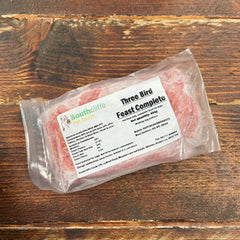 southcliffe 3 bird feast complete mince in clear packaging on wooden board